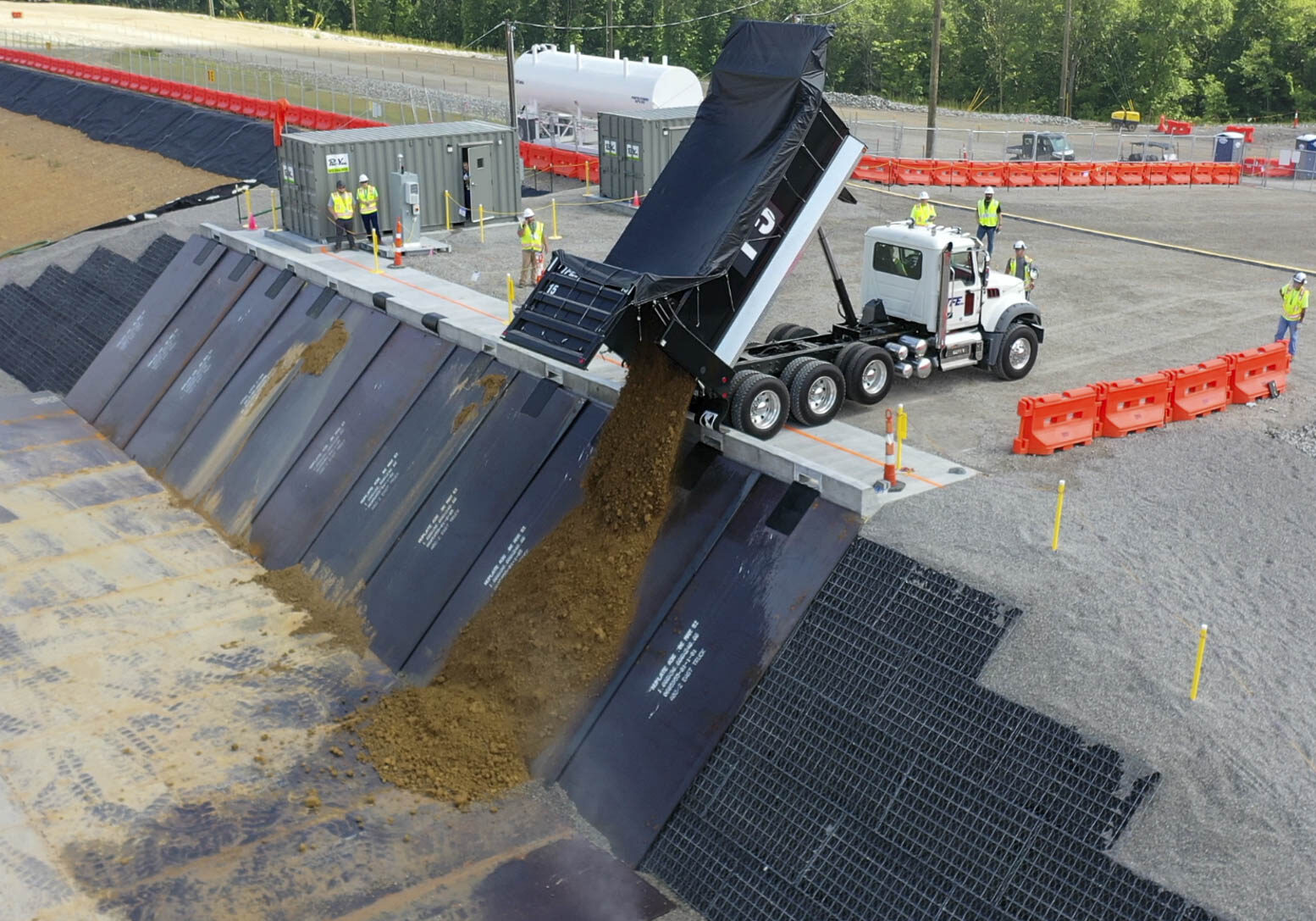 The first load of impacted soil from the X-740 Plume Excavation Project is placed into Cell 1 at the PORTS On-Site Waste Disposal Facility.